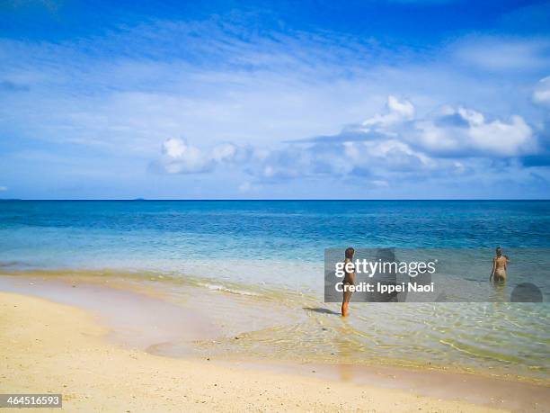 women enjoying tropical beach with clear water - miyakojima stock pictures, royalty-free photos & images