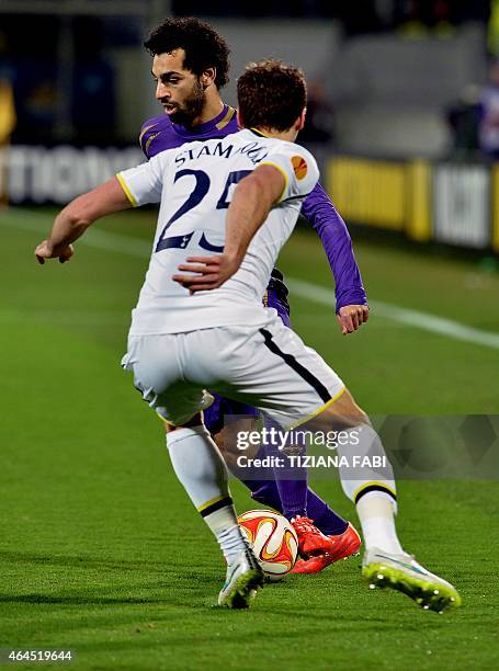 Fiorentina's Egyptian midfielder Mohamed Salah vies with Tottenham Hotspur's French midfielder Benjamin Stambouli during the UEFA Europa League round...