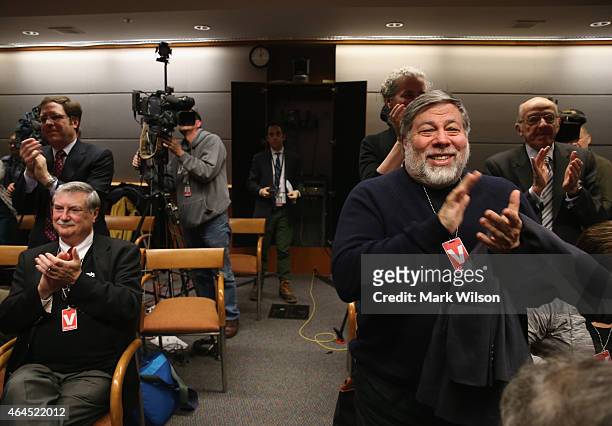 Apple Co-Founder Steve Wozniak applauds after the Federal Communications Commission voted to approve Net Neutrality during a hearing at the FCC...