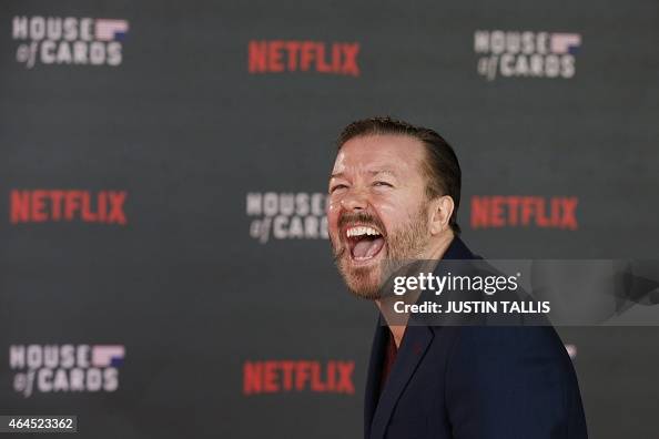 British comedian and actor Ricky Gervais smiles as he poses for... News