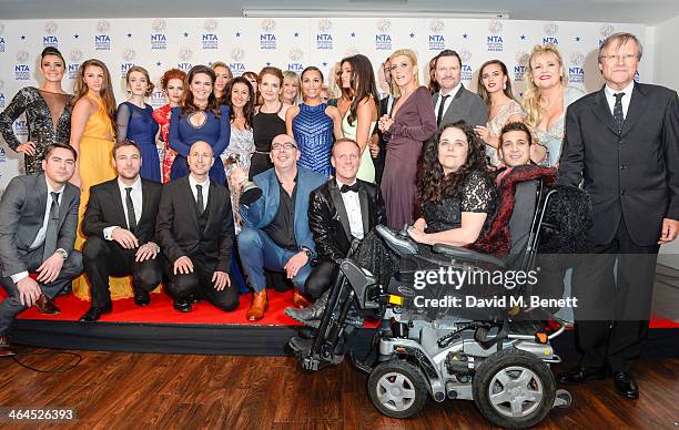 The cast and crew of 'Coronation Street' pose with their Serial Drama Award in front of the winners boards at the National Television Awards at 02...