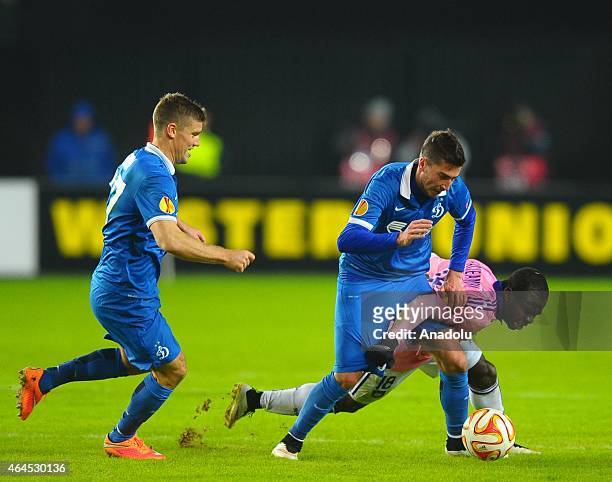 Alexei Ionov of Dynamo Moscow vies for the ball with Franck Archeampong during the UEFA Europe League football match between Dynamo Moscow and...