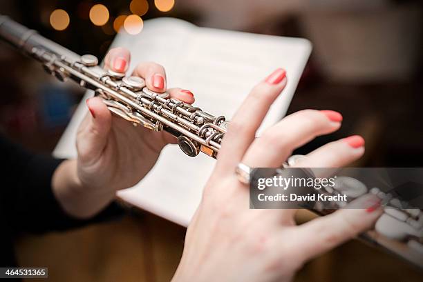 playing the transverse flute - flauto foto e immagini stock