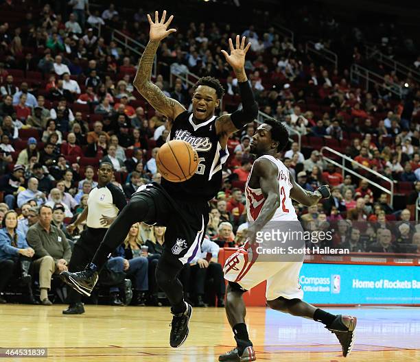 Ben McLemore of the Sacramento Kings battles for the ball with Patrick Beverley of the Houston Rockets during the game at the Toyota Center on...