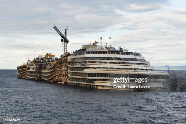 The stricken Costa Concordia cruise ship remains in the water on January 22, 2014 in Isola del Giglio, Italy. Tomorrow, for the first time since the...