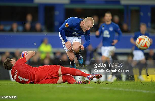 Steven Naismith of Everton is fouled by goalkeeper Marco Wolfli of BSC Young Boys to win a penalty during the UEFA Europa League Round of 32 match...