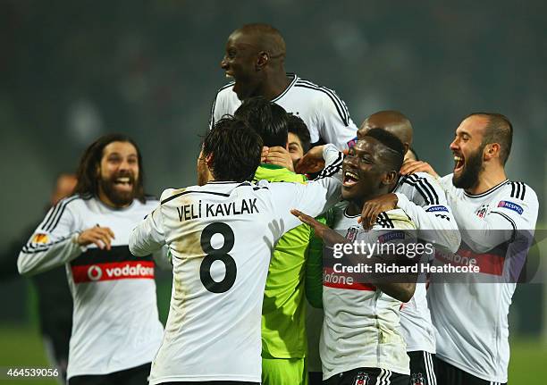 Besiktas players celebrate victory in the penalty shoot out as Dejan Lovren of Liverpool misses the decisive kick during the UEFA Europa League Round...