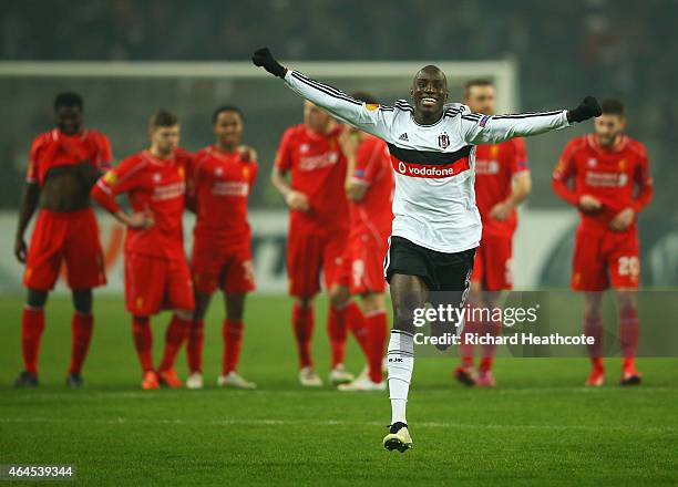 Liverpool players look dejected as Demba Ba of Besiktas celebrates as Dejan Lovren of Liverpool misses the decisive kick in the penalty shoot out...