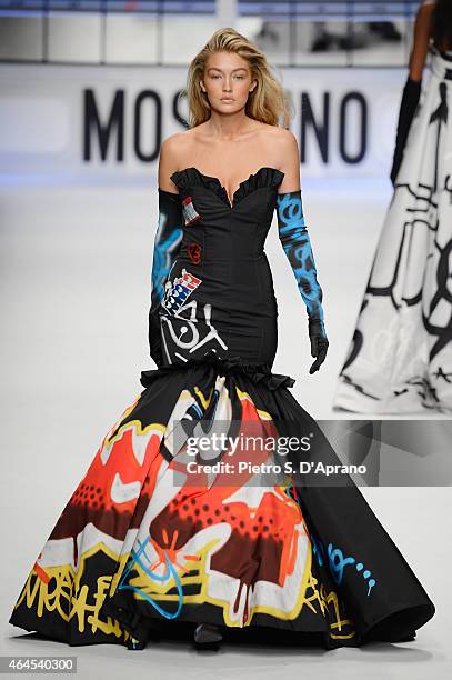 Gigi Hadid walks the runway at the Moschino show during the Milan Fashion Week Autumn/Winter 2015 on February 26, 2015 in Milan, Italy.