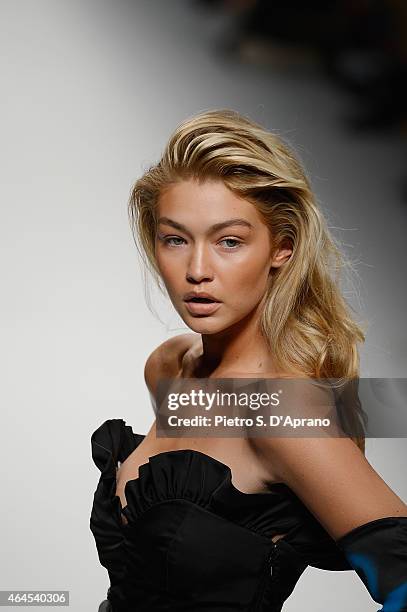 Gigi Hadid walks the runway at the Moschino show during the Milan Fashion Week Autumn/Winter 2015 on February 26, 2015 in Milan, Italy.