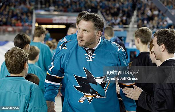 San Jose Sharks alumni Brian Marchment walks on to the field before the 2015 Coors Light NHL Stadium Series game between the Los Angeles Kings and...
