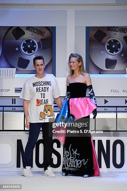 Designer Jeremy Scott acknowledges the applause of the audience after the Moschino show during the Milan Fashion Week Autumn/Winter 2015 on February...