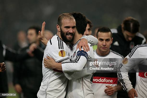 Besiktas' players celebrate after winning the match by penalties against Liverpool during the UEFA Europa League round of 32 soccer match between...