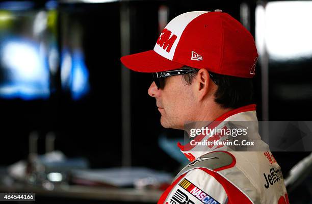 Jeff Gordon, driver of the 3M Chevrolet, stands in the garage during a testing session at Atlanta Motor Speedway on February 26, 2015 in Hampton,...