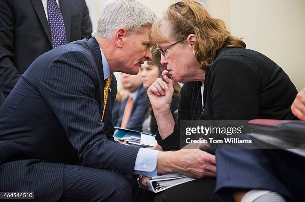 Sen. Bill Cassidy, R-La., talks with an aide during a Senate Veterans' Affairs Committee hearing titled "FY2016 Budget for Veterans' Programs and...