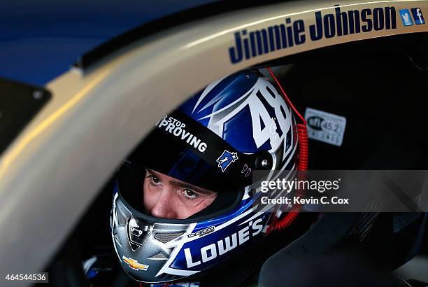 Jimmie Johnson, driver of the Lowe's Chevrolet, sits in his car during a testing session at Atlanta Motor Speedway on February 26, 2015 in Hampton,...