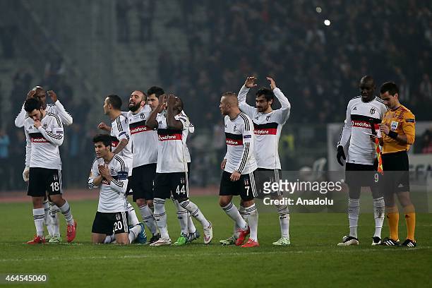 Besiktas' players celebrate after scoring a goal by penalties against Liverpool during the UEFA Europa League round of 32 soccer match between...