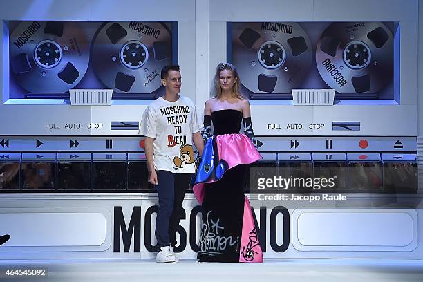 Designer Jeremy Scott acknowledges the applause of the audience after the Moschino show during the Milan Fashion Week Autumn/Winter 2015 on February...