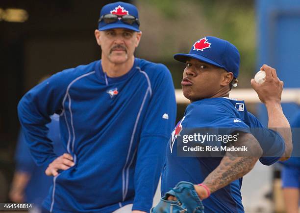 Pitcher Marcus Stroman works in the bullpen as pitching coach Pete Walker looks on. The Jays work out at the Bobby Mattock Training Facility in...