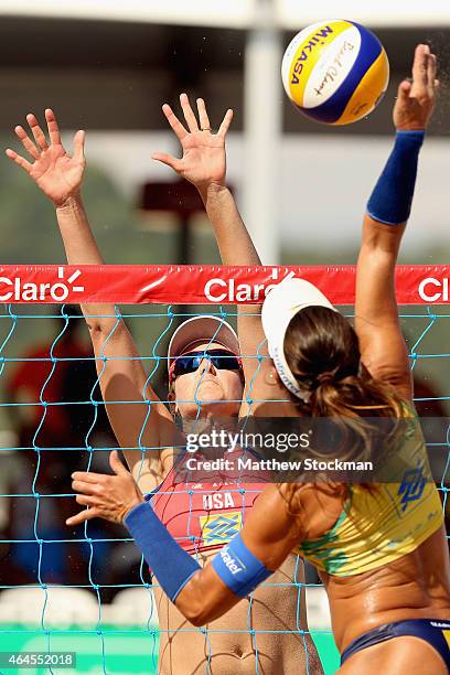 Jennifer Kessy of the United States and Maria Elisa Antonelli of Brazil in action at the net during the Brazil v USA Beach Volleyball International...