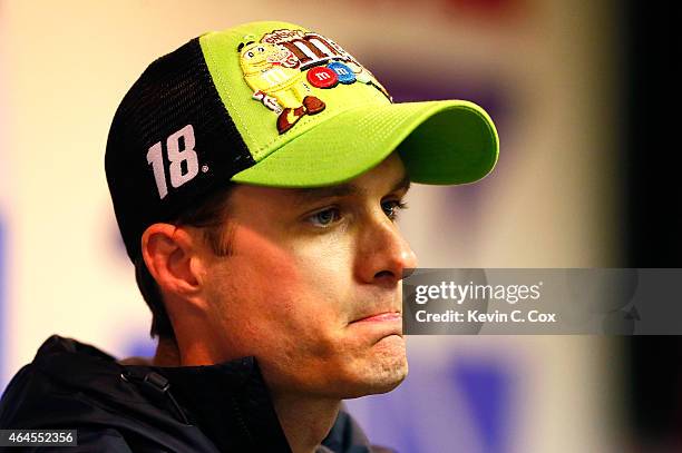 David Ragan, driver of the M&M's Crispy Toyota, speaks to the media after a testing session at Atlanta Motor Speedway on February 26, 2015 in...