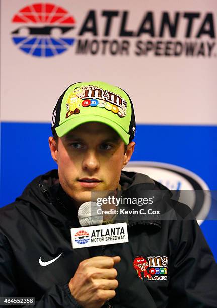 David Ragan, driver of the M&M's Crispy Toyota, speaks to the media after a testing session at Atlanta Motor Speedway on February 26, 2015 in...