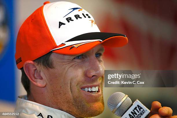 Carl Edwards, driver of the Arris Toyota, speaks to members of the media during a testing session at Atlanta Motor Speedway on February 26, 2015 in...