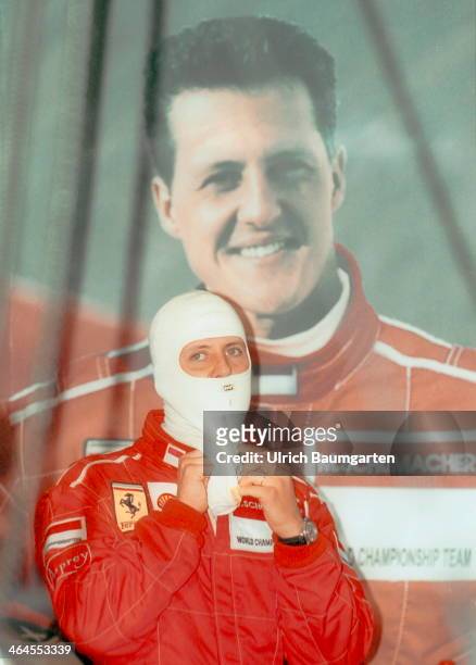 Michael Schumacher with head protection on the edge of the Formula 1 Grang Prix at the Hockenheimring. In the background Schumacher posters, on July...