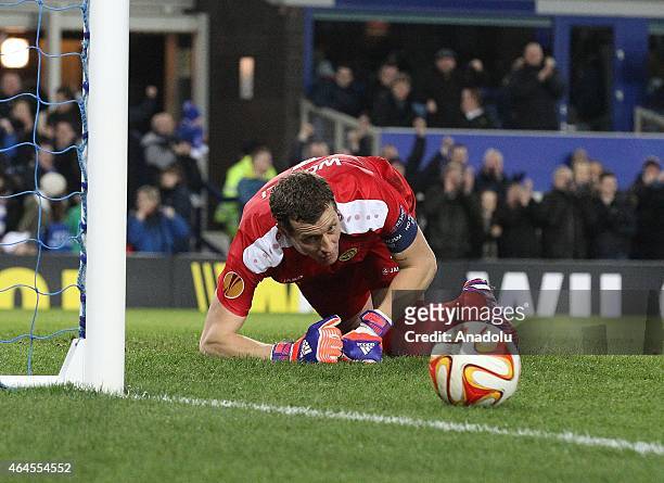 Young Boys' goalkeeper Marco Wolfli shows dejection after failing to save Everton's second goal during the UEFA Europa League round of 32 soccer...