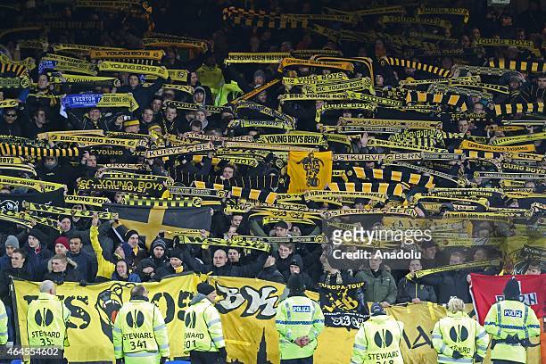 Young Boys fans support their team during the UEFA Europa League round of 32 soccer match between Everton and Young Boys at Goodison Park stadium in...