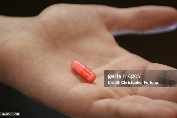 Youth holds a 'Legal High' chemical pill on February 26, 2015 in Manchester, England. There has been a significant rise in the use of Legal Highs...