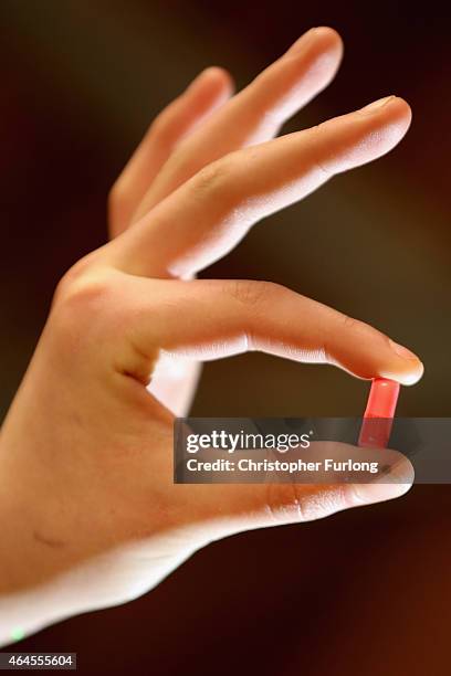 Youth holds a 'Legal High' chemical pill on February 26, 2015 in Manchester, England. There has been a significant rise in the use of Legal Highs...