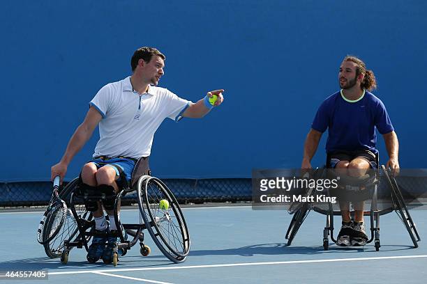 Adam Kellerman of Australia and Joachim Gerard of Belgium in action in their wheelchair doubles semifinal match against Stephane Houdet of France and...