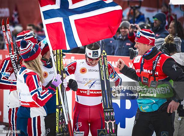 Norwegian Head Coach Egil Kristiansen, Astrid Uhrenholdt Jacobsen, Heidi Weng, Therese Johaug and Marit Bjoergen of Norway celebrate their gold medal...