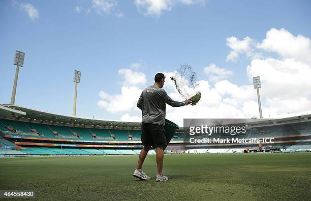 Groundsman works on the pitch before the 2015 ICC Cricket World Cup match between South Africa and the West Indies at Sydney Cricket Ground on...