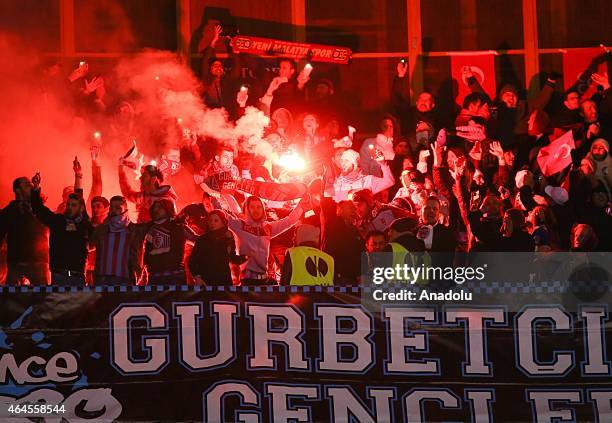 Trabzonspor fans support their team during the UEFA Europa League Round of 32 second leg football match between Napoli and Trabzonspor AS at the San...