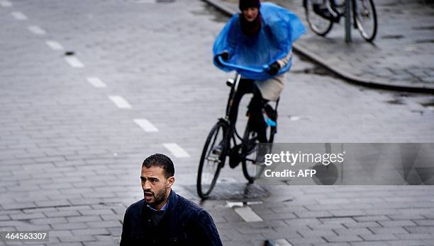 Moroccan-Dutch Former K-1 heavyweight kick-boxing champion Badr Hari arrives at the courthouse in Amsterdam, the Netherlands, on January 23, 2014....
