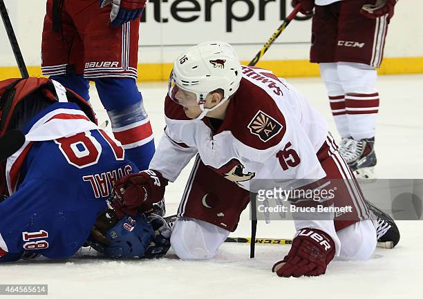 Henrik Samuelsson of the Arizona Coyotes hjolds Marc Staal of the New York Rangers down at Madison Square Garden on February 26, 2015 in New York...