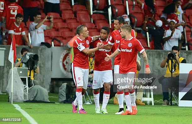 Andres D´Alessandro of Internacional celebrates with teammates after scoring the first goal of his team during a match between Internacional and U de...