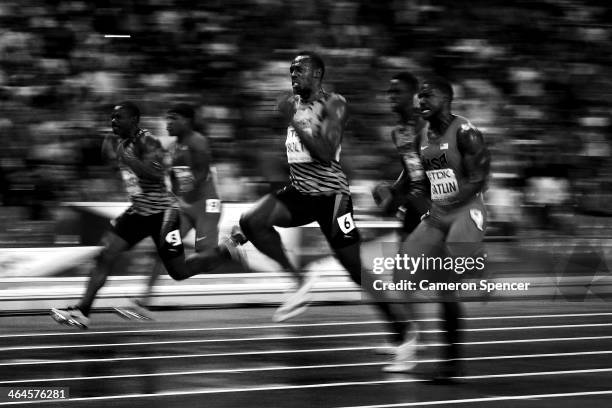 Usain Bolt of Jamaica and Justin Gatlin of the United States compete in the Men's 100 metres Final during Day Two of the 14th IAAF World Athletics...