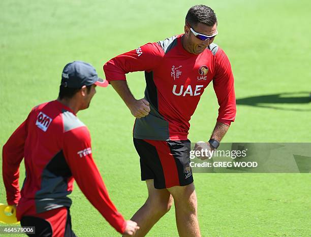 United Arab Emirates fielding coach Paul Franks has fun during a final training session ahead of their Pool B 2015 Cricket World Cup match against...