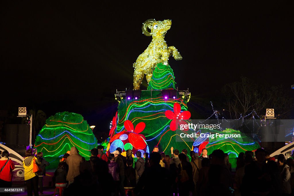 Crowds gather in front of the main lantern. The character is...