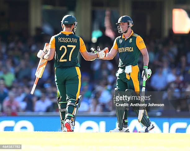 South African captain AB De Villiers shakes the hand of Rilee Rossouw after he was dismissed by Jerome Taylor during the 2015 ICC Cricket World Cup...