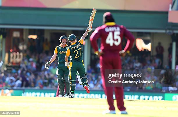 South African batsman Rilee Rossouw celebrates his 50 with AB De Villiers during the 2015 ICC Cricket World Cup match between South Africa and the...