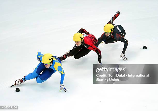 Denis Nikisha of Kazakhstan, Leon Kaufmann-Ludwig and Firat Yardimci of Turkey compete in Men's 1000m heats during day one of the ISU World Junior...