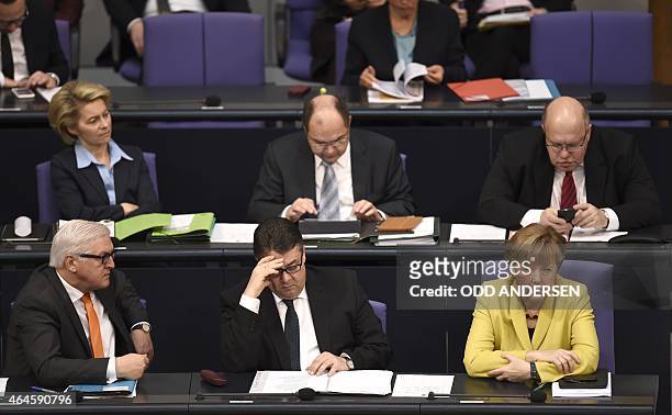German Foreign Minister Frank-Walter Steinmeier, Vice Chancellor, Economy and Energy Minister Sigmar Gabriel and German Chancellor Angela Merkel sit...
