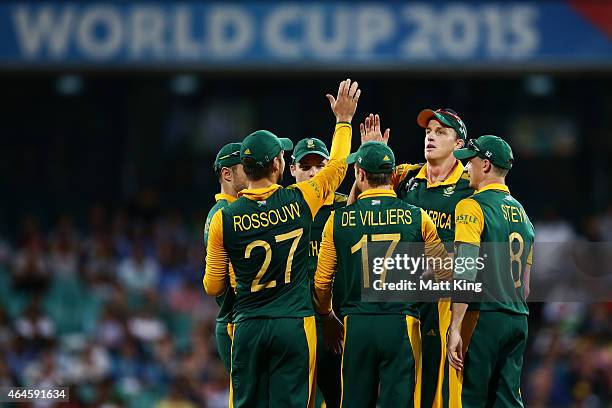 Morne Morkel of South Africa celebrates with team mates after taking the wicket of Jonathan Carter of West Indies during the 2015 ICC Cricket World...