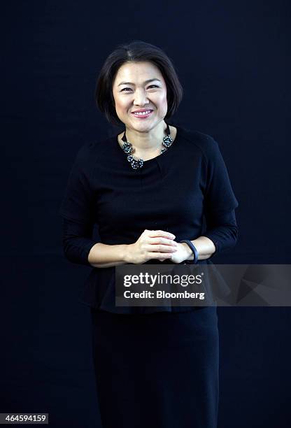 Zhang Xin, billionaire and chief executive officer of Soho China Ltd., poses for a photograph following a Bloomberg Television interview on day two...