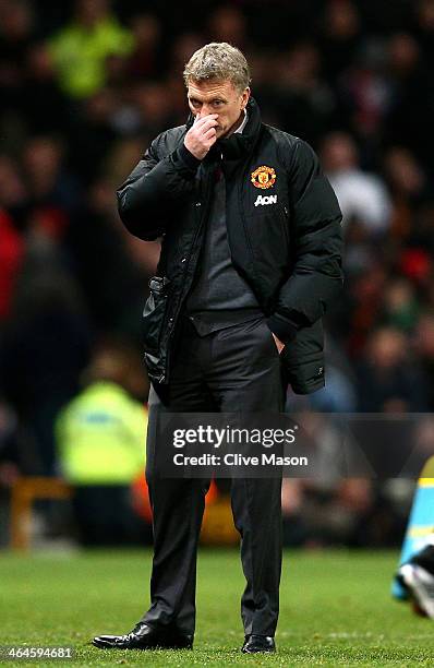 Dejected David Moyes the Manchester United manager looks on during the Capital One Cup semi final, second leg match between Manchester United and...