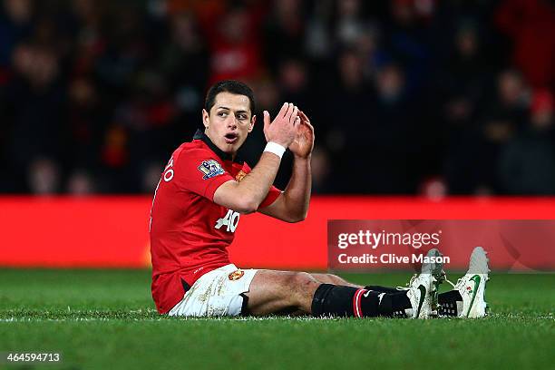 Dejected Javier Hernandez of manchhester United reacts after a missed chance on goal during the Capital One Cup semi final, second leg match between...